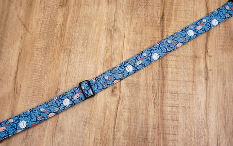 shell on light blue ukulele shoulder strap with leather ends-2