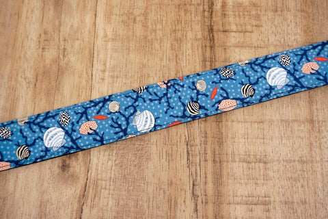 shell on light blue ukulele shoulder strap with leather ends-5