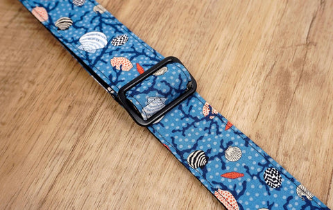 shell on light blue ukulele shoulder strap with leather ends-6